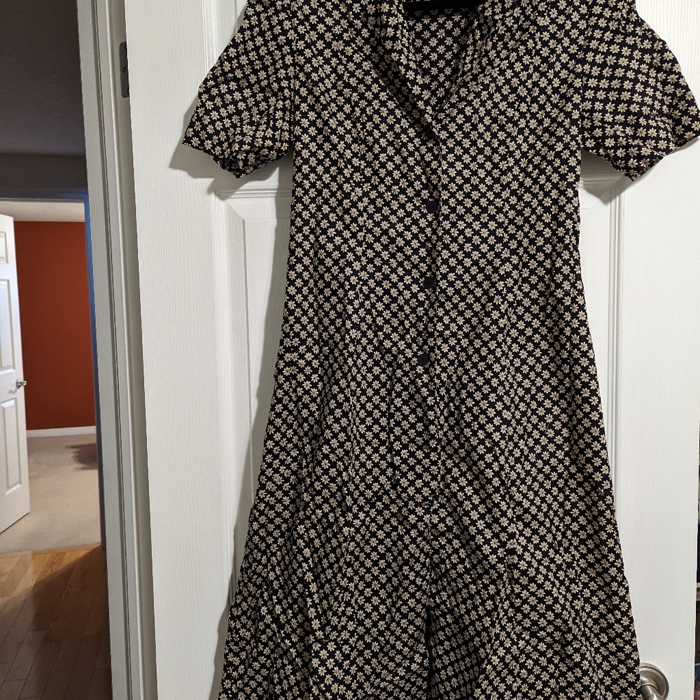 Collared button down midi dress with a lovely floral pattern